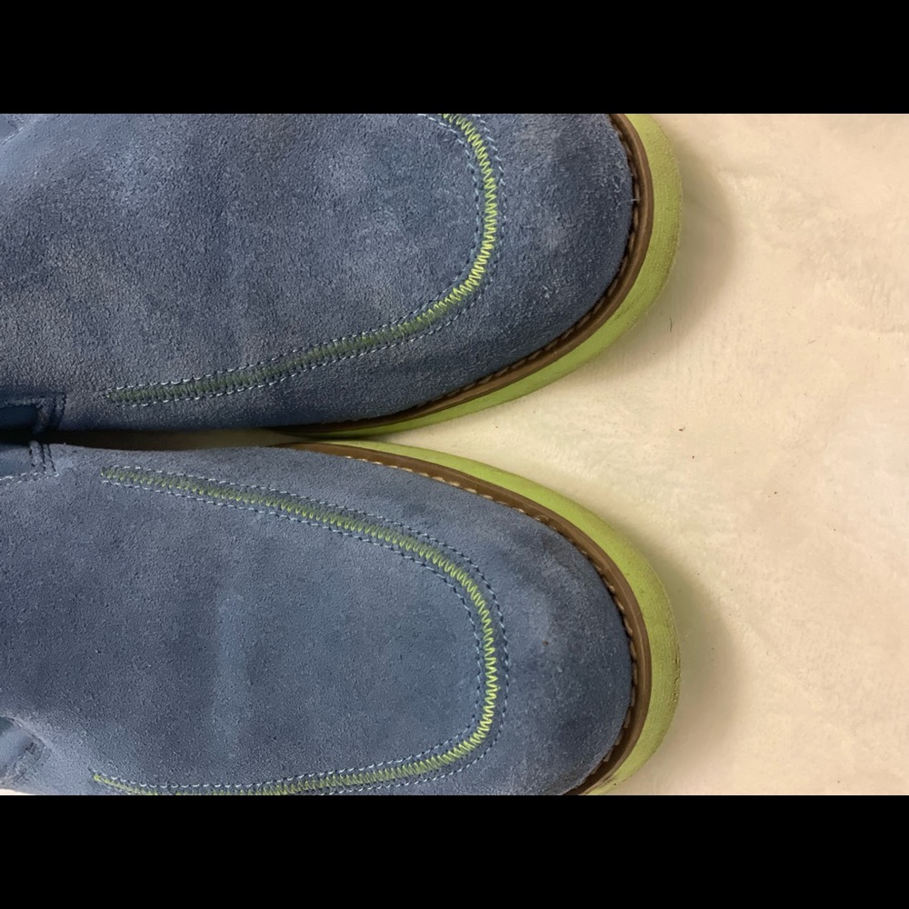 This shoe is a light blue lime green sole. The sole has a few marks